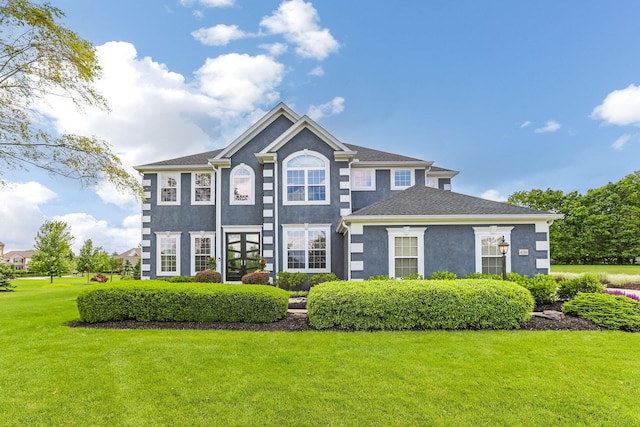 4166 Borge Way, Dublin, OH 43016 - view of front facade with stucco siding and a front yard