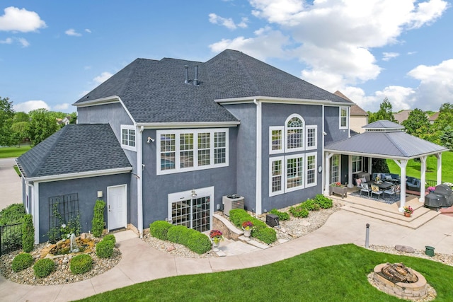 4166 Borge Way, Dublin, OH 43016 - rear view of house featuring a gazebo, an outdoor fire pit, stucco siding, a patio area, and a yard