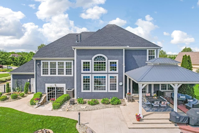 4166 Borge Way, Dublin, OH 43016 - rear view of house with central air condition unit, stucco siding, a patio area, an outdoor living space, and a shingled roof