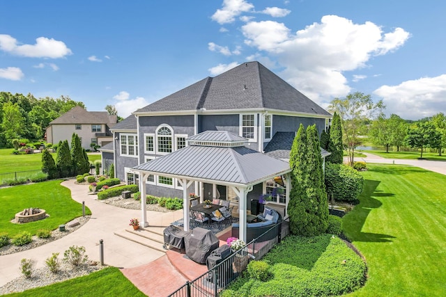 4166 Borge Way, Dublin, OH 43016 - back of house with an outdoor fire pit, a patio, stucco siding, a gazebo, and roof with shingles