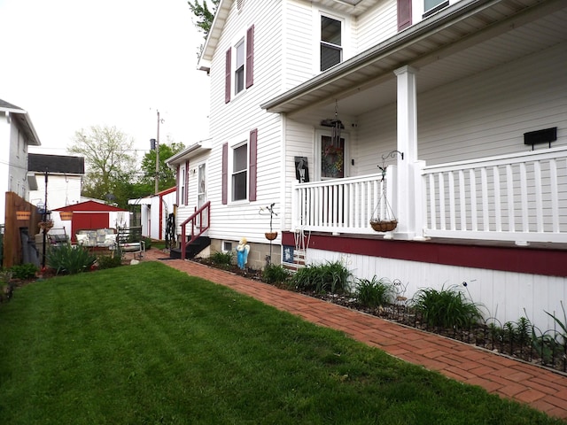 1202 W Mulberry St, Lancaster, OH 43130 - view of property exterior with a porch and a lawn