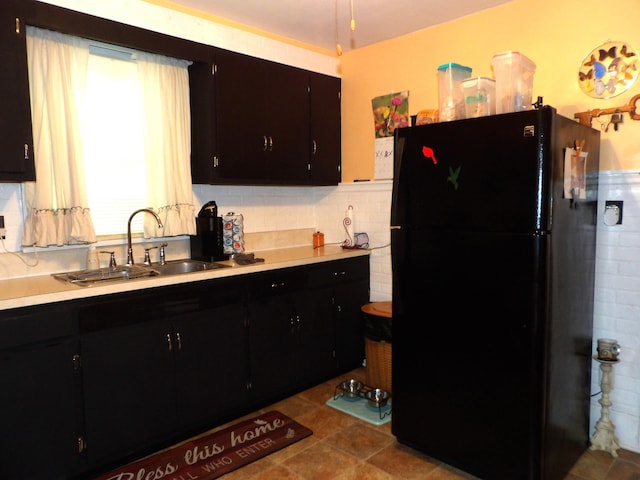 1202 W Mulberry St, Lancaster, OH 43130 - kitchen featuring freestanding refrigerator, a sink, light countertops, and dark cabinetry