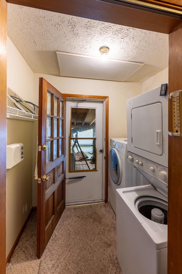 clothes washing area with carpet and a textured ceiling