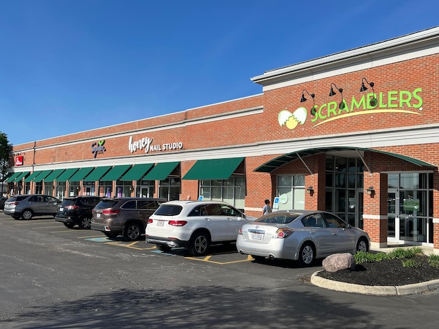 view of commercial location featuring uncovered parking