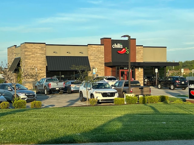 view of commercial location with uncovered parking