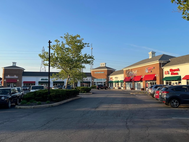 view of commercial property with uncovered parking