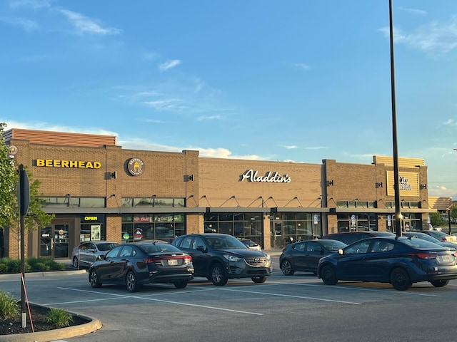 view of commercial location with uncovered parking