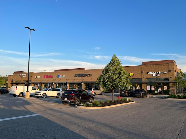 view of commercial property featuring uncovered parking