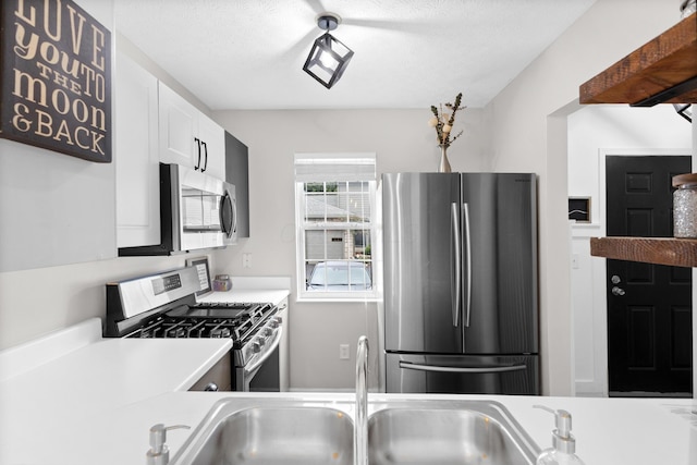 4102 Blendon Way Dr, Columbus, OH 43230 - kitchen featuring stainless steel appliances, light countertops, and white cabinets