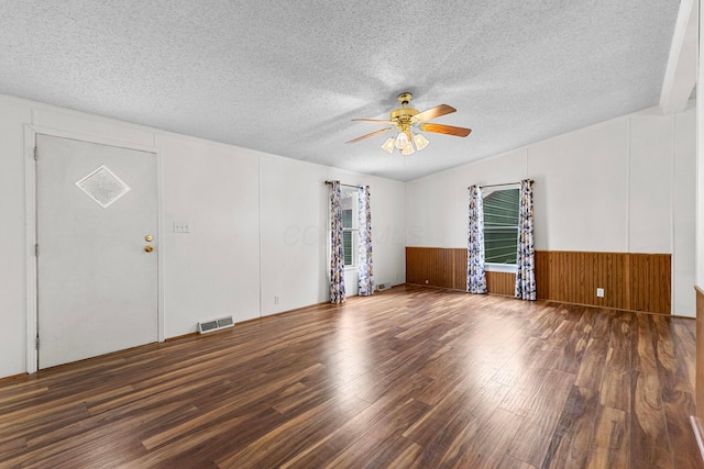 8164 Atlantic St, Caledonia, OH 43314 - empty room featuring wood finished floors, ceiling fan, a textured ceiling, and wainscoting