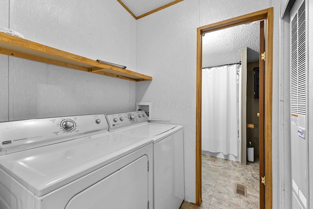 8164 Atlantic St, Caledonia, OH 43314 - clothes washing area with washer and dryer, a textured wall, a textured ceiling, ornamental molding, and a heating unit