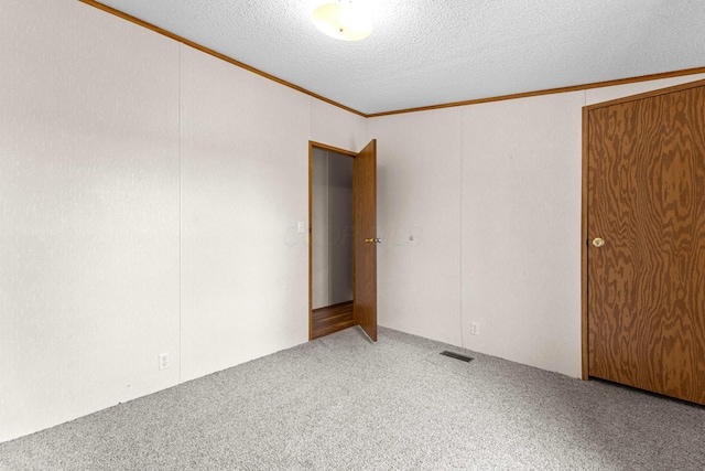 8164 Atlantic St, Caledonia, OH 43314 - unfurnished bedroom with carpet, crown molding, and a textured ceiling