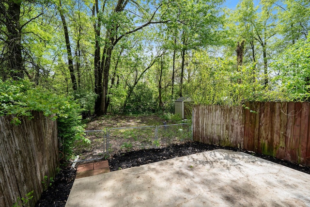 3860 Julia Ct, Columbus, OH 43230 - view of patio / terrace featuring fence, a storage shed, and an outbuilding