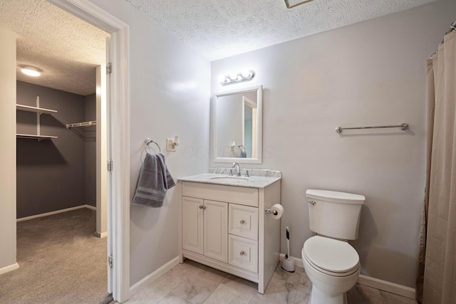 3860 Julia Ct, Columbus, OH 43230 - full bathroom with a textured ceiling, vanity, toilet, and baseboards