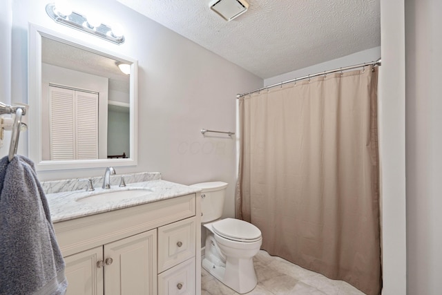 3860 Julia Ct, Columbus, OH 43230 - full bath with a textured ceiling, vanity, toilet, and tile patterned floors
