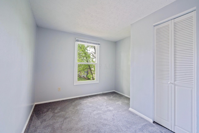 3860 Julia Ct, Columbus, OH 43230 - unfurnished bedroom with carpet flooring, a textured ceiling, a closet, and baseboards