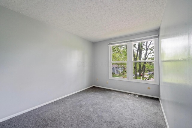 3860 Julia Ct, Columbus, OH 43230 - carpeted spare room featuring a textured ceiling and baseboards
