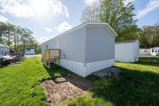view of home's exterior with a lawn