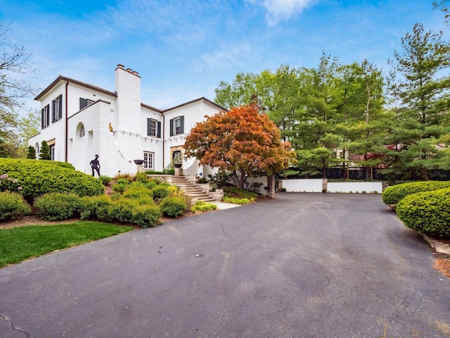 10 Park Dr, Columbus, OH 43209 - view of side of property with stucco siding and a chimney