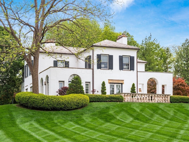 10 Park Dr, Columbus, OH 43209 - view of front of property with a chimney, stucco siding, and a front yard