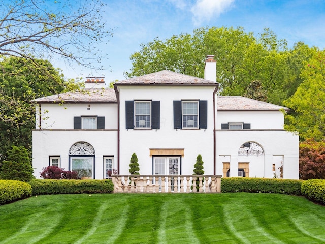 10 Park Dr, Columbus, OH 43209 - rear view of property with a chimney, a yard, stucco siding, and a high end roof