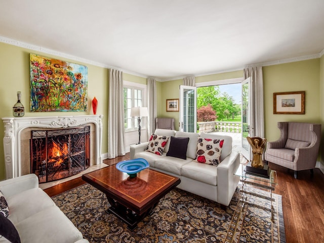 10 Park Dr, Columbus, OH 43209 - living room featuring wood finished floors, crown molding, and a premium fireplace