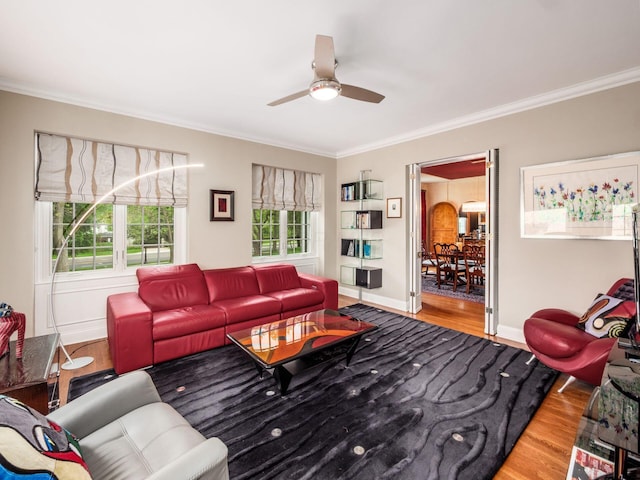 10 Park Dr, Columbus, OH 43209 - living area featuring wood finished floors, plenty of natural light, crown molding, ceiling fan, and baseboards