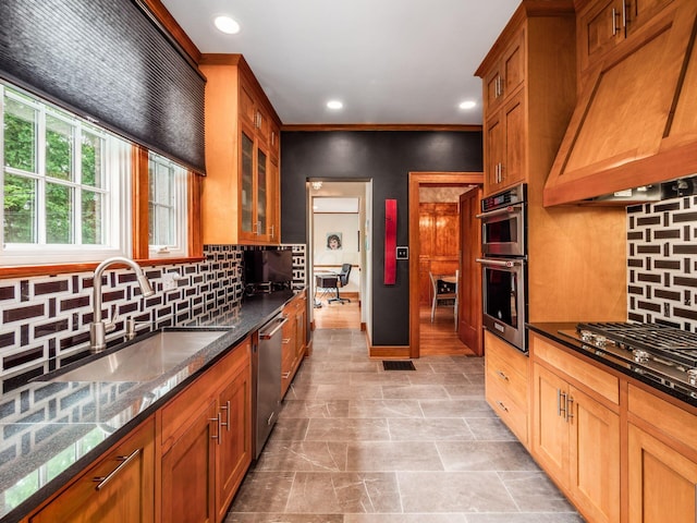 10 Park Dr, Columbus, OH 43209 - kitchen with a sink, appliances with stainless steel finishes, custom exhaust hood, recessed lighting, and decorative backsplash