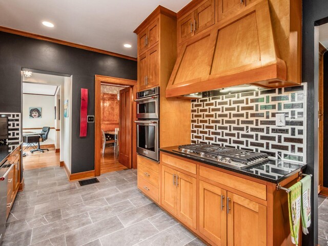 10 Park Dr, Columbus, OH 43209 - kitchen featuring custom exhaust hood, stainless steel appliances, tasteful backsplash, recessed lighting, and dark stone counters