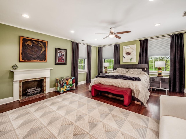 10 Park Dr, Columbus, OH 43209 - bedroom with multiple windows, ornamental molding, baseboards, wood finished floors, and a fireplace