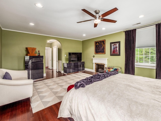 10 Park Dr, Columbus, OH 43209 - bedroom with arched walkways, wood finished floors, recessed lighting, ornamental molding, and baseboards