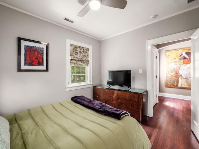 10 Park Dr, Columbus, OH 43209 - bedroom with dark wood-style flooring, crown molding, baseboards, and ceiling fan