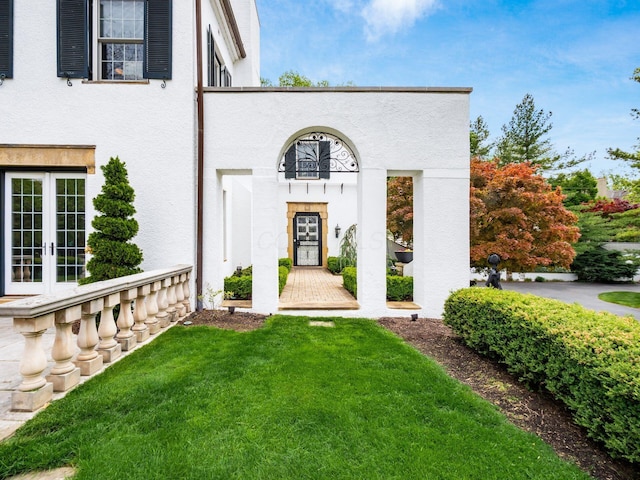 10 Park Dr, Columbus, OH 43209 - entrance to property with french doors, stucco siding, and a lawn