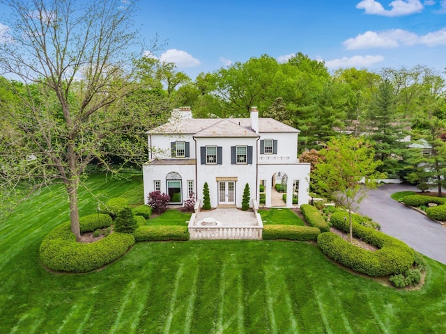 10 Park Dr, Columbus, OH 43209 - back of property featuring stucco siding, french doors, a chimney, and a yard