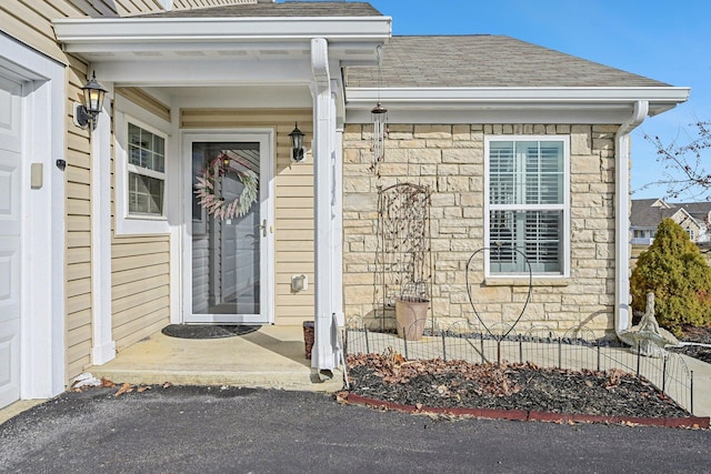1753 Chestnut Farms Loop, Grove City, OH 43123 - view of exterior entry featuring stone siding and roof with shingles
