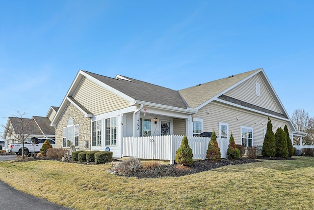 1753 Chestnut Farms Loop, Grove City, OH 43123 - view of side of home featuring stone siding and roof with shingles