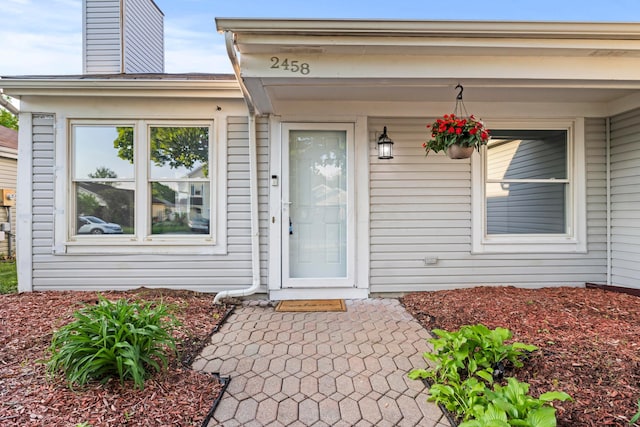 2458 Dunsworth Dr, Columbus, OH 43235 - property entrance featuring a chimney