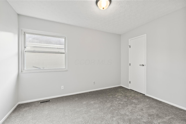 2458 Dunsworth Dr, Columbus, OH 43235 - spare room with carpet floors, baseboards, and a textured ceiling