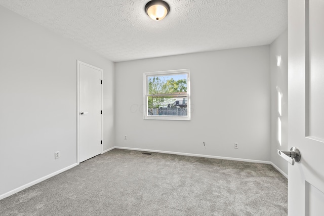 2458 Dunsworth Dr, Columbus, OH 43235 - spare room featuring carpet, a textured ceiling, and baseboards