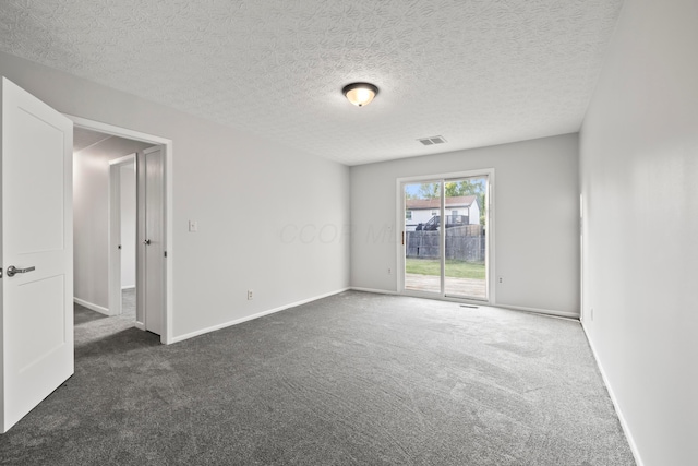 2458 Dunsworth Dr, Columbus, OH 43235 - spare room featuring carpet flooring, baseboards, and a textured ceiling