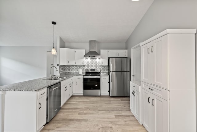 2458 Dunsworth Dr, Columbus, OH 43235 - kitchen featuring stainless steel appliances, a sink, wall chimney exhaust hood, white cabinets, and a peninsula