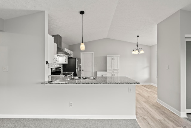 2458 Dunsworth Dr, Columbus, OH 43235 - kitchen featuring appliances with stainless steel finishes, wall chimney exhaust hood, a sink, a peninsula, and white cabinets