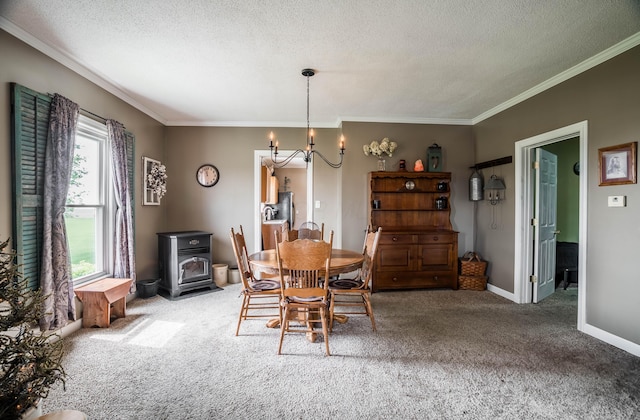 6010 Versailles Rd, Piqua, OH 45356 - carpeted dining room featuring a chandelier, a textured ceiling, ornamental molding, a wood stove, and baseboards