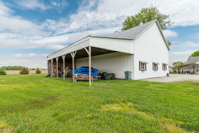 6010 Versailles Rd, Piqua, OH 45356 - view of pole building with a lawn and a detached carport