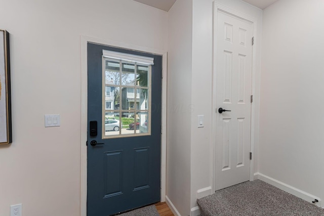 549 Hanford St, Columbus, OH 43206 - doorway with baseboards and carpet flooring