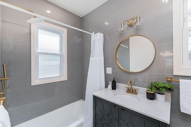 549 Hanford St, Columbus, OH 43206 - full bath featuring shower / bath combination with curtain, vanity, decorative backsplash, and tile walls