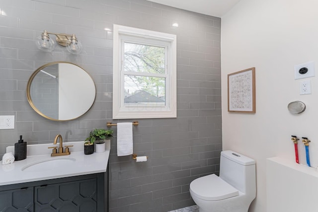 549 Hanford St, Columbus, OH 43206 - bathroom featuring tile walls, toilet, and vanity