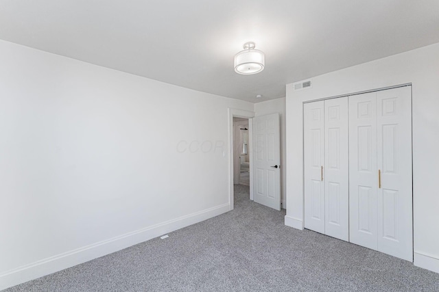 549 Hanford St, Columbus, OH 43206 - unfurnished bedroom featuring carpet floors, baseboards, and a closet