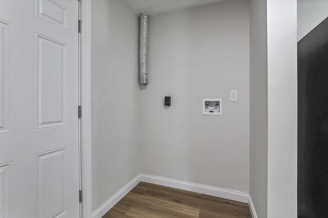 clothes washing area featuring hookup for an electric dryer, hookup for a washing machine, baseboards, and dark wood-style floors