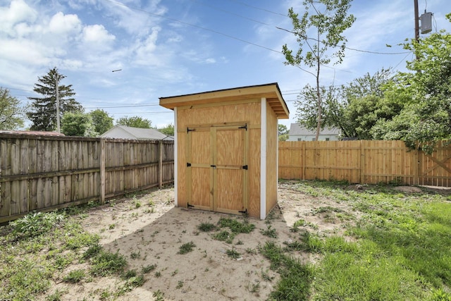 view of shed featuring a fenced backyard